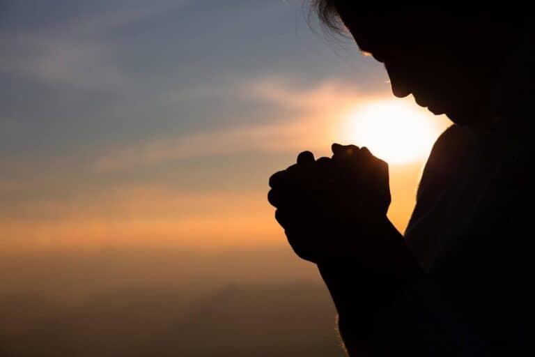 Religious young woman praying to God in the morning, spirtuality and religion, Religious concepts