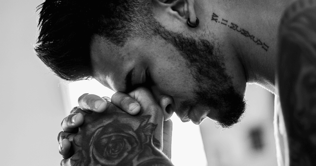 Man Praying with rose tattoo bw (Jesus)